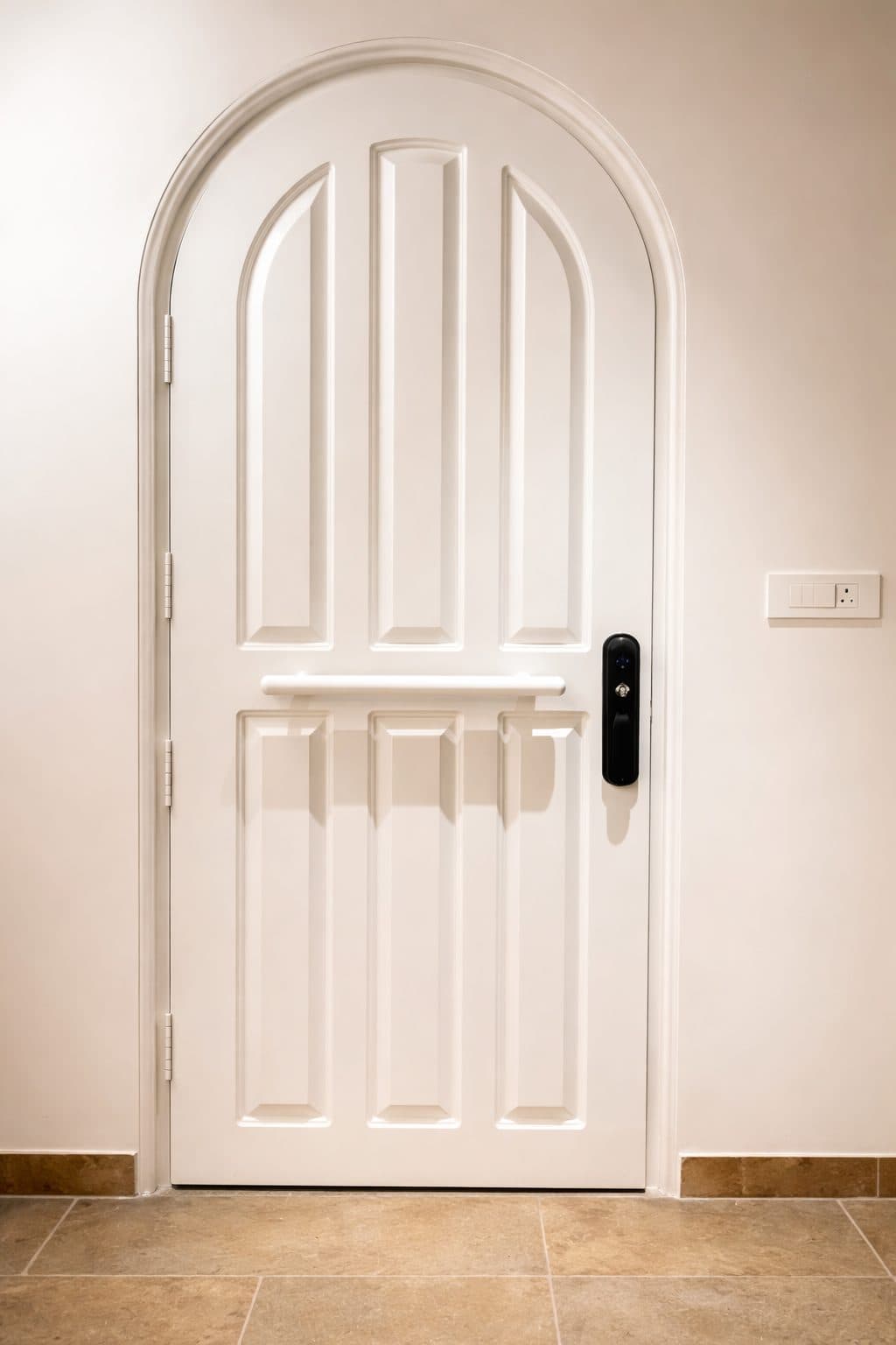 Arched panelled door in a white finish