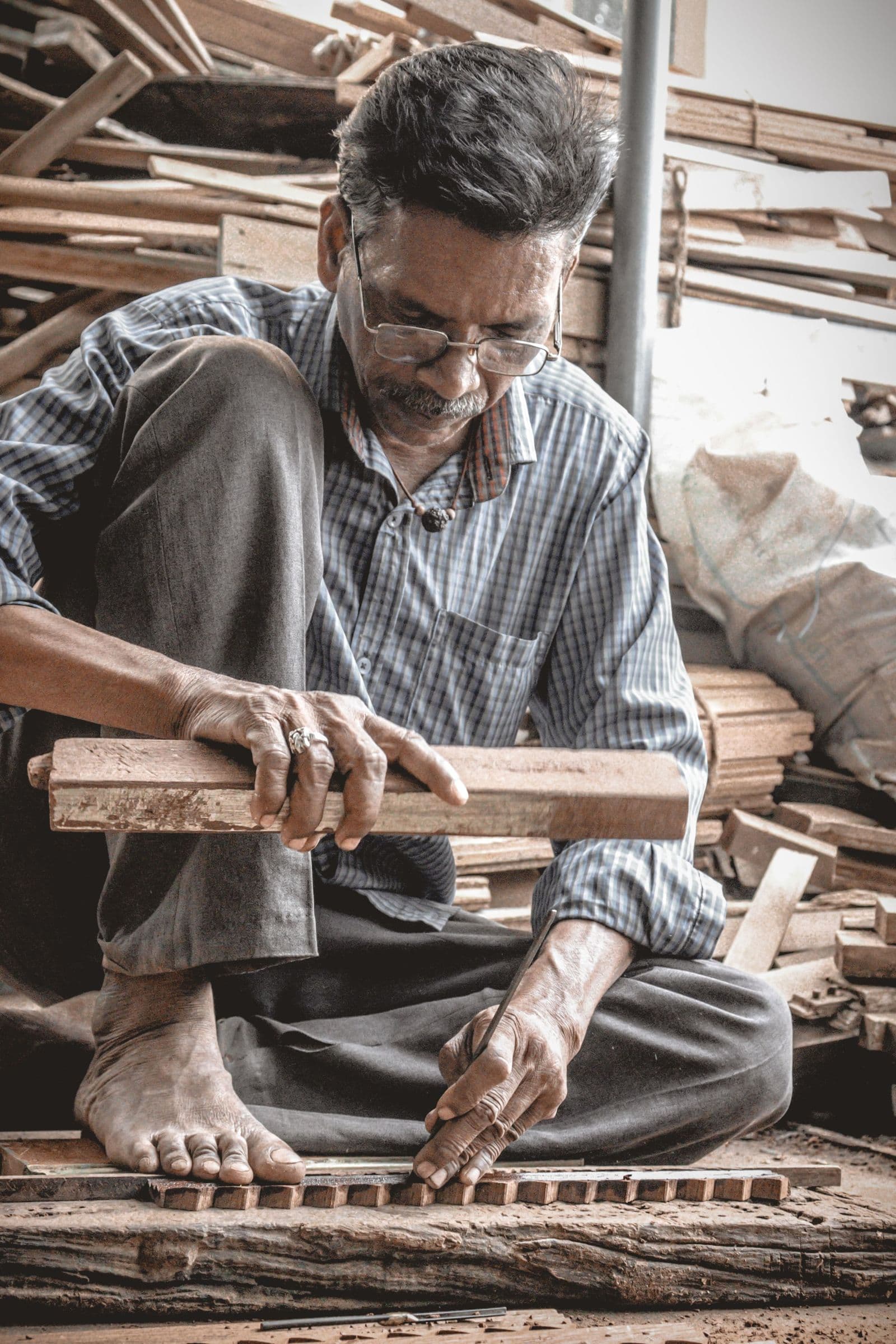 A carpenter measuring a frame