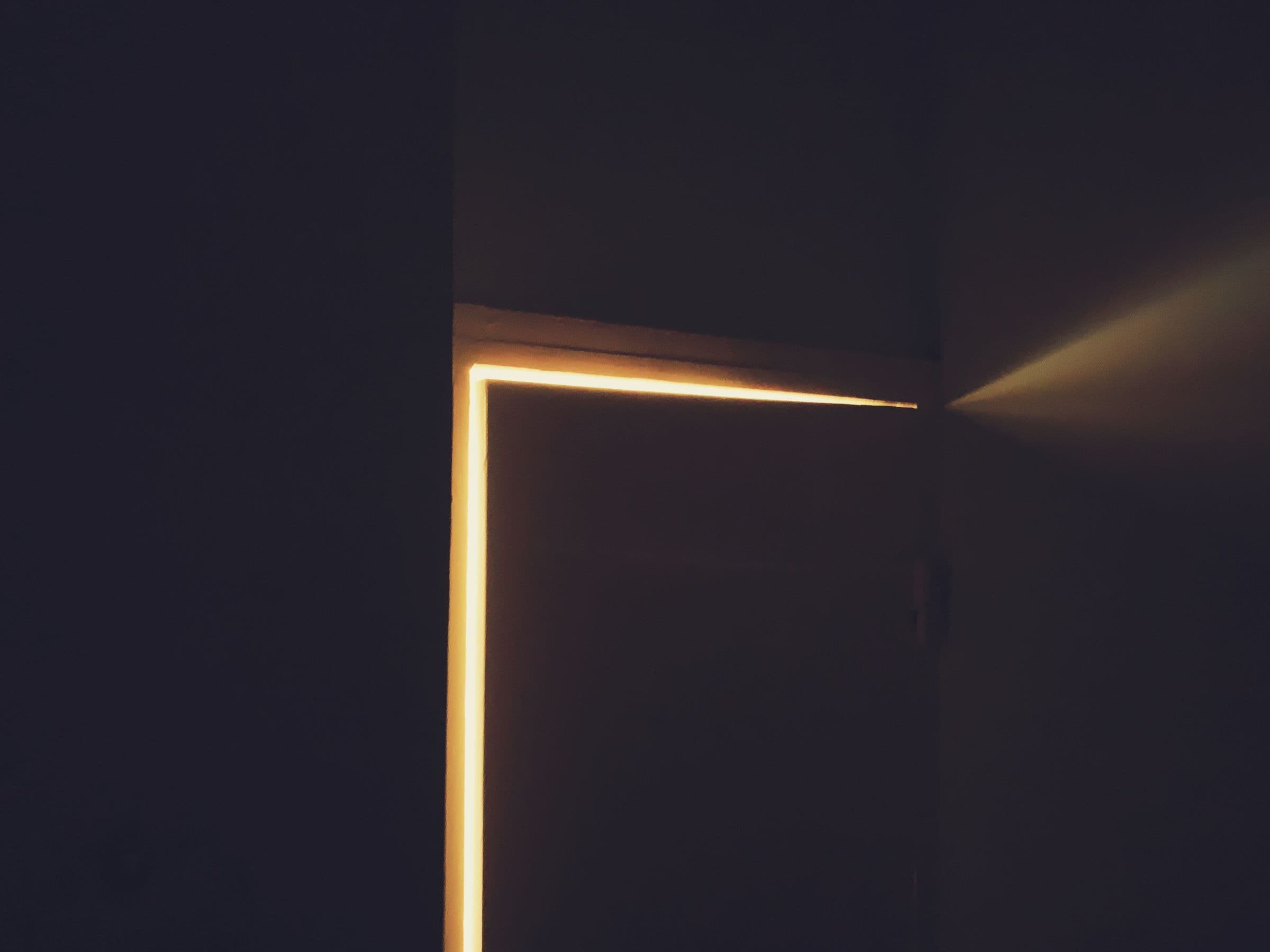 Warm light through a door left ajar