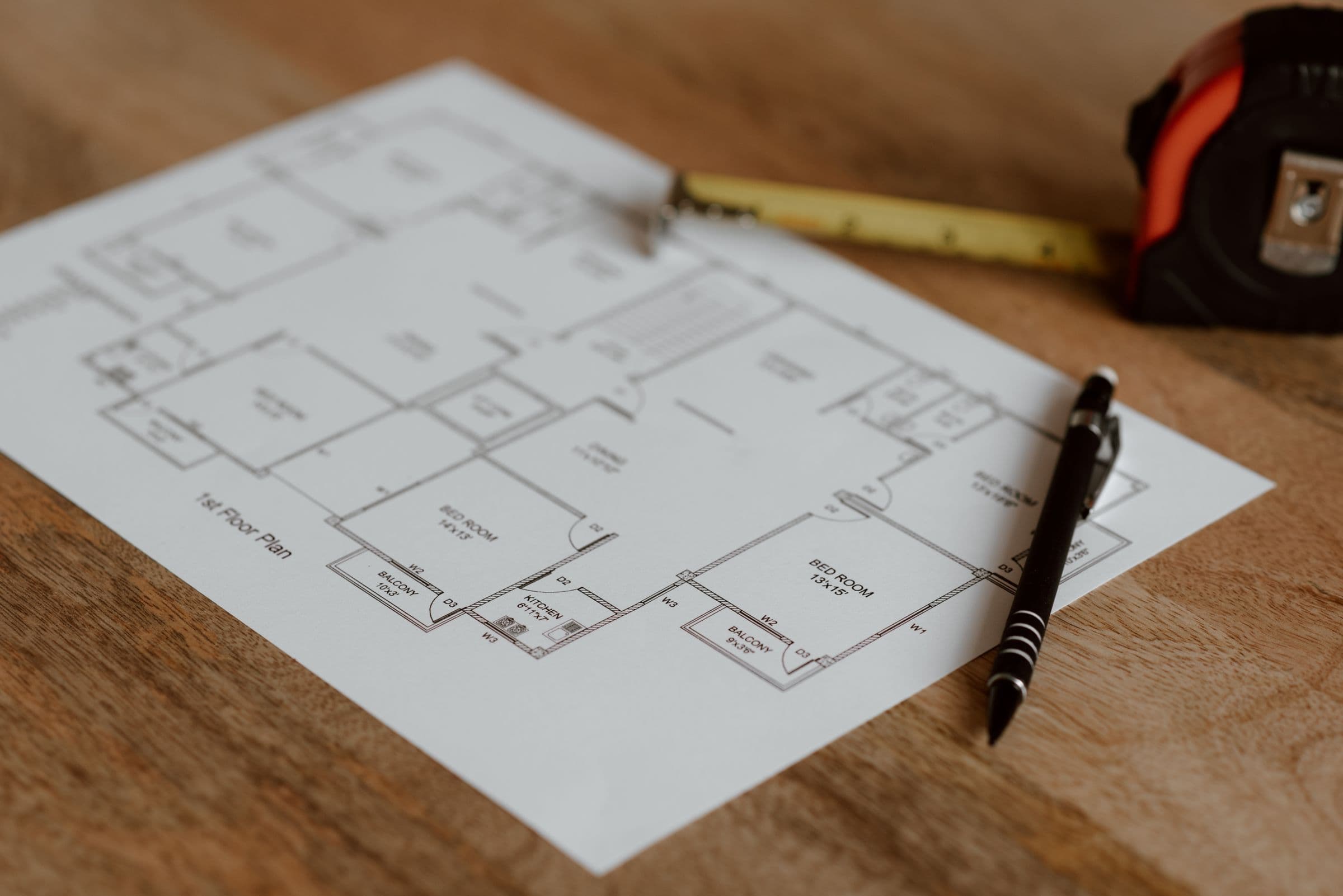 Plans and tape measure on a desk